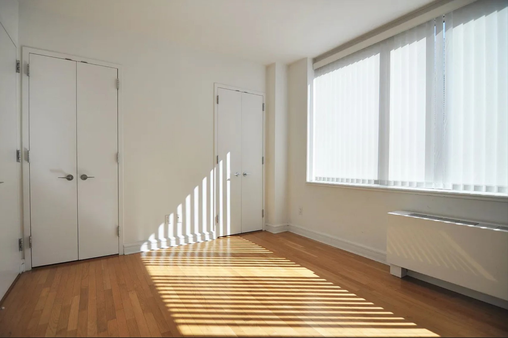 120 Riverside Boulevard, Unit 8J Manhattan, NY 10069 - Photo 4 of 13 a view of a room with wooden floor and staircase