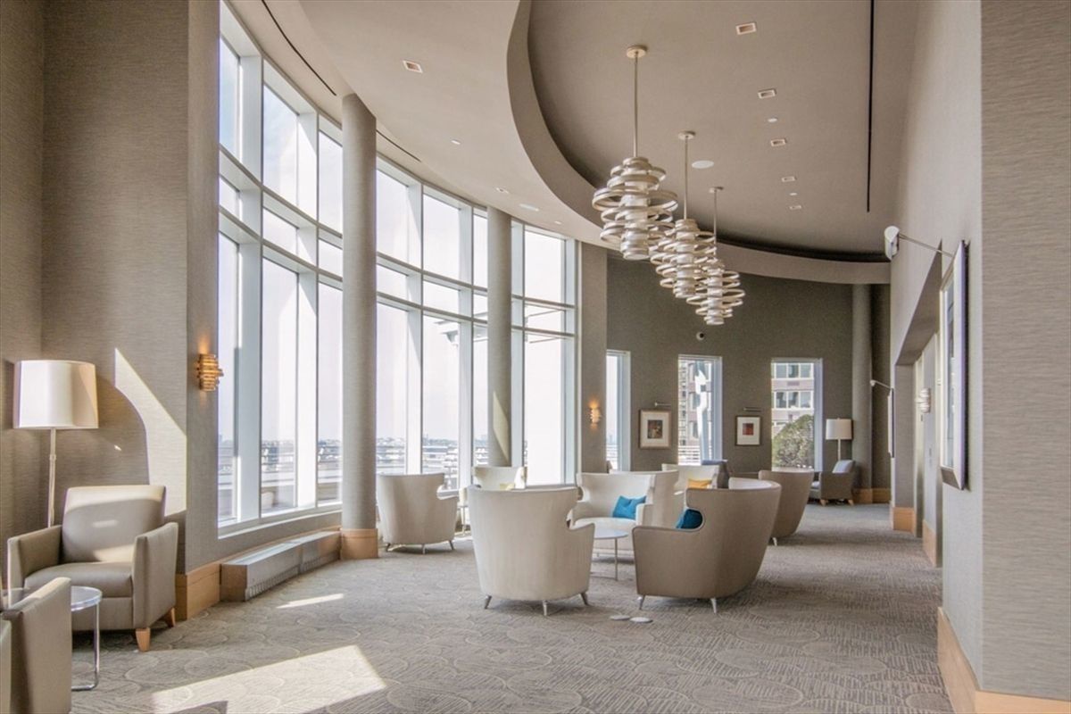 120 Riverside Boulevard, Unit 8J Manhattan, NY 10069 - Photo 8 of 13 a lobby with furniture and large windows