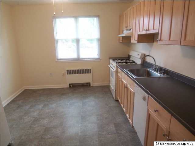 142 South Street, Unit 9A Red Bank, NJ 07701 - Photo 3 of 3 a kitchen with sink cabinets and window