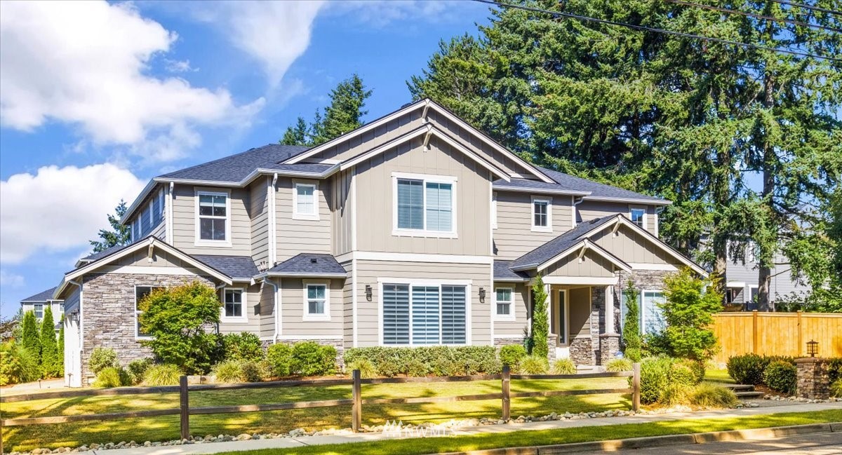 1441 242nd Place Southeast Bothell, WA 98021 - Photo 1 of 40 a front view of a house with a yard