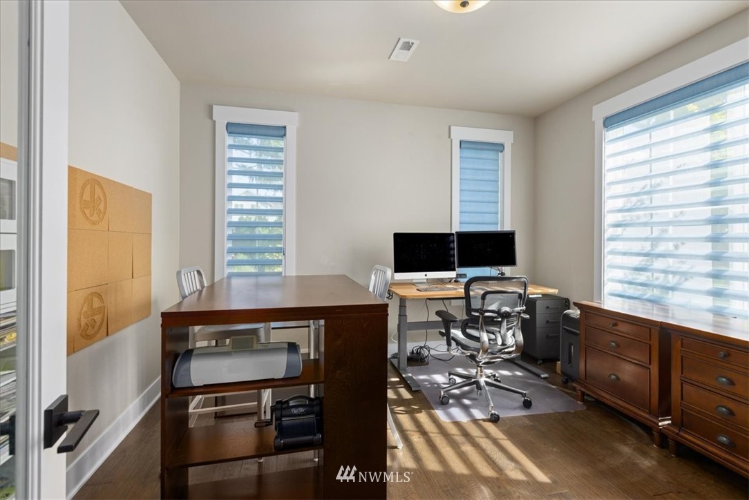 1441 242nd Place Southeast Bothell, WA 98021 - Photo 13 of 40 a view of a workspace with furniture and a window