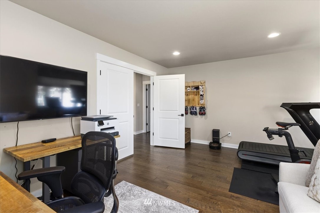 1441 242nd Place Southeast Bothell, WA 98021 - Photo 17 of 40 a living room with furniture and a flat screen tv