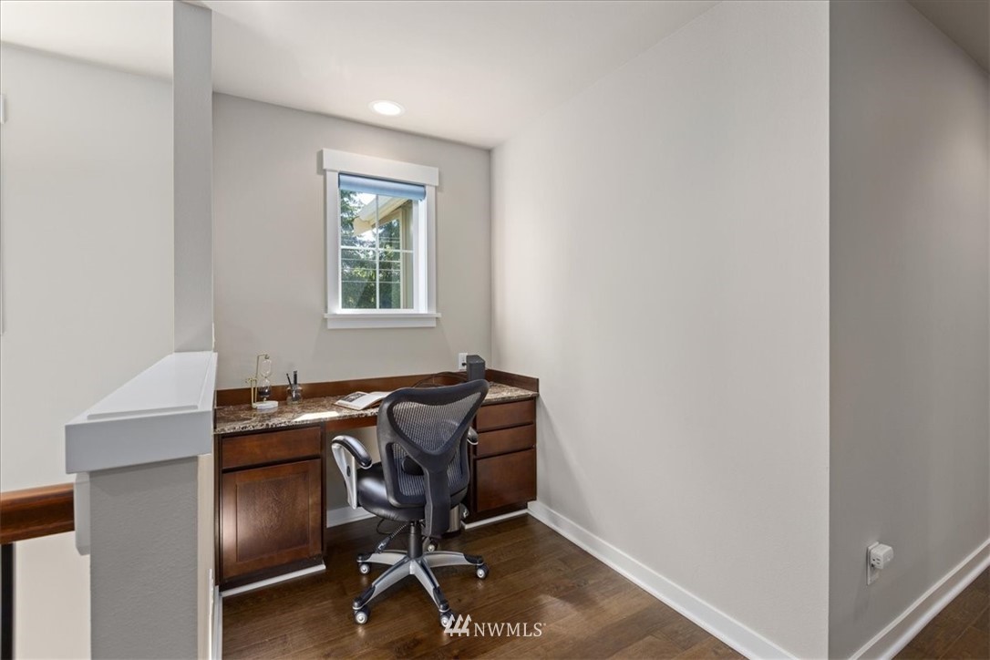 1441 242nd Place Southeast Bothell, WA 98021 - Photo 19 of 40 a view of workspace with wooden floor windows