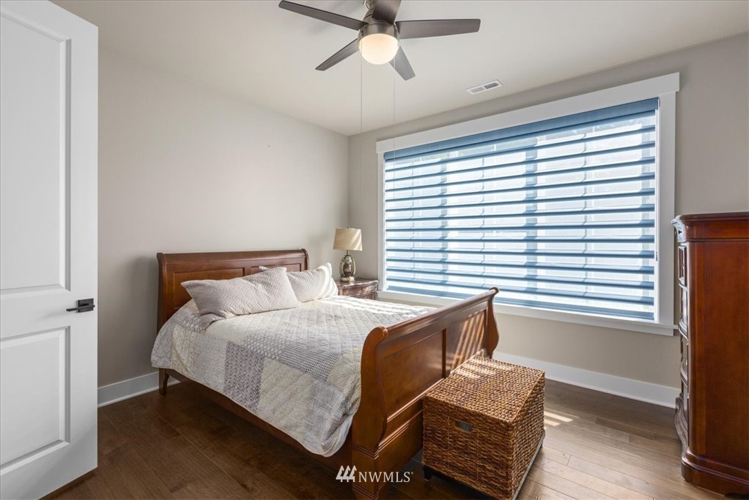 1441 242nd Place Southeast Bothell, WA 98021 - Photo 20 of 40 a bedroom with a bed and window