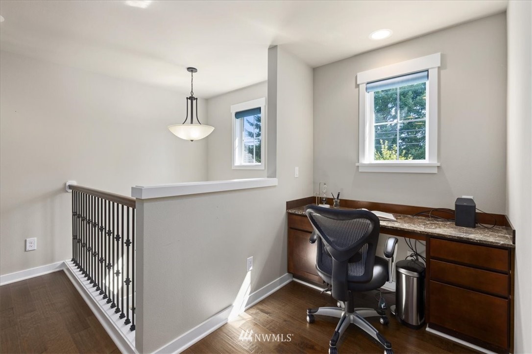 1441 242nd Place Southeast Bothell, WA 98021 - Photo 24 of 40 a view of a workspace with furniture and a window