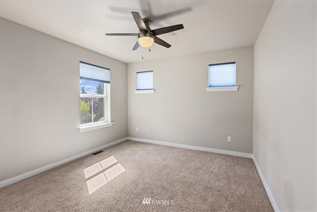1441 242nd Place Southeast Bothell, WA 98021 - Photo 27 of 40 a view of room with a ceiling fan and window