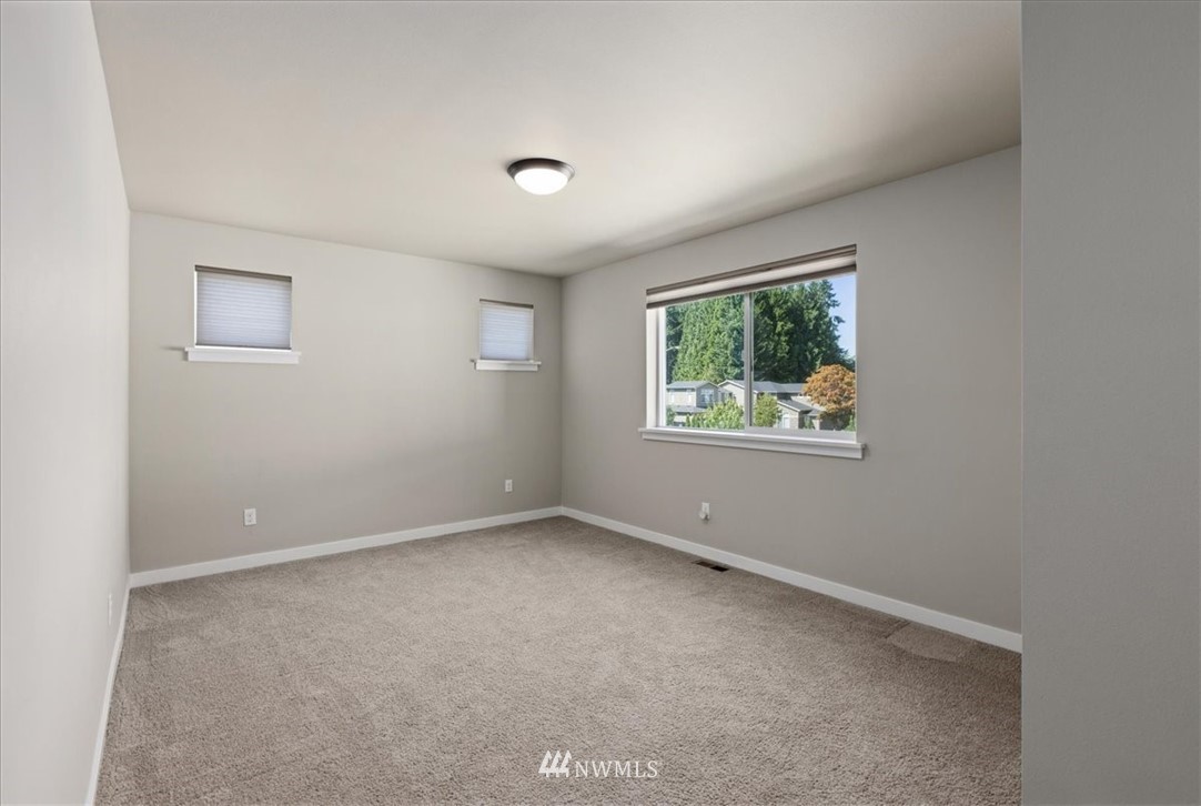 1441 242nd Place Southeast Bothell, WA 98021 - Photo 30 of 40 an empty room with windows
