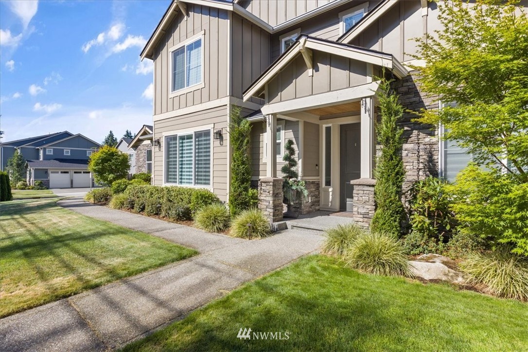 1441 242nd Place Southeast Bothell, WA 98021 - Photo 4 of 40 a view of a front of house with a yard