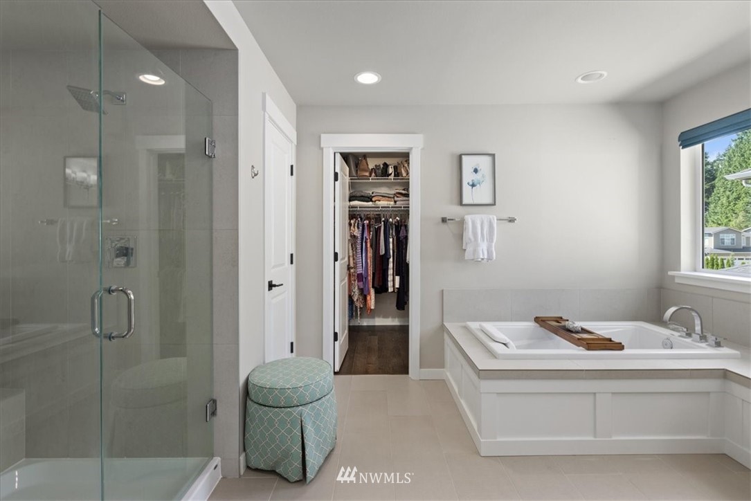 1441 242nd Place Southeast Bothell, WA 98021 - Photo 35 of 40 a bathroom with a tub and shower