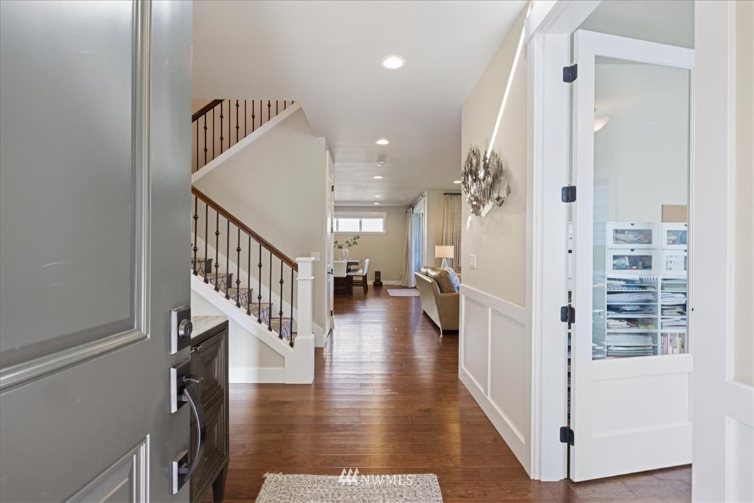 1441 242nd Place Southeast Bothell, WA 98021 - Photo 5 of 40 a view of a hallway with windows and stairs