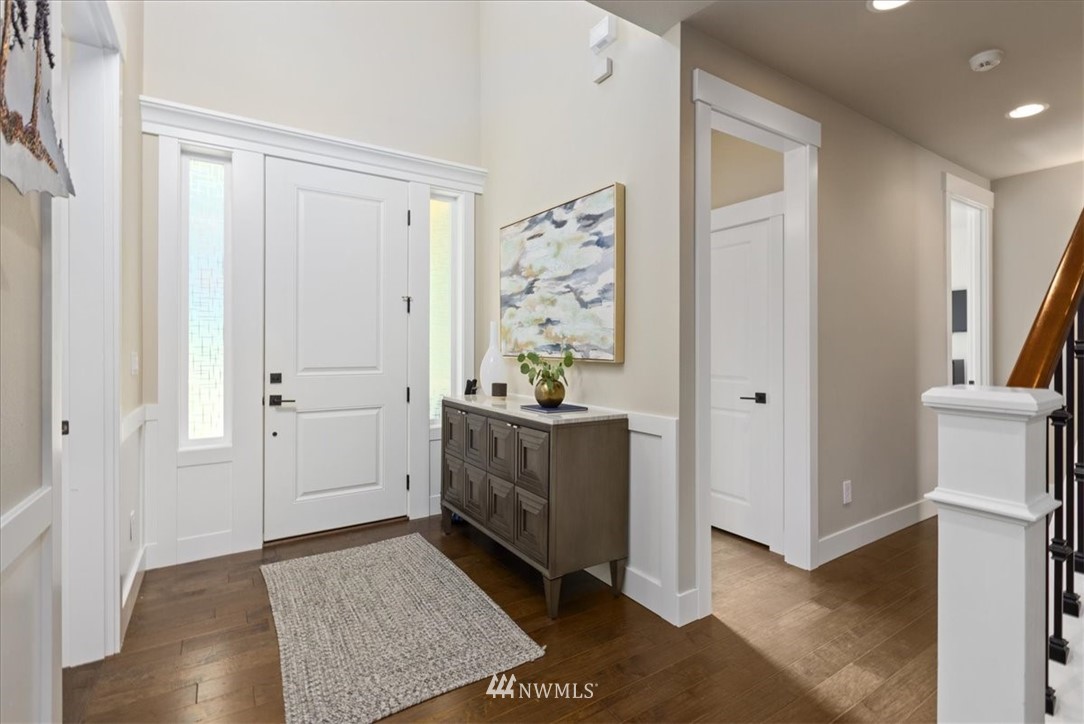 1441 242nd Place Southeast Bothell, WA 98021 - Photo 6 of 40 a view of a hallway with bathroom and wooden floor