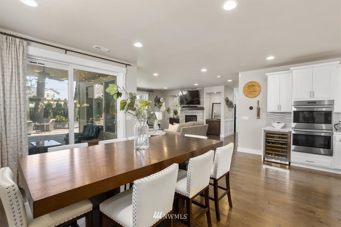 1441 242nd Place Southeast Bothell, WA 98021 - Photo 9 of 40 a dining room with furniture and wooden floor