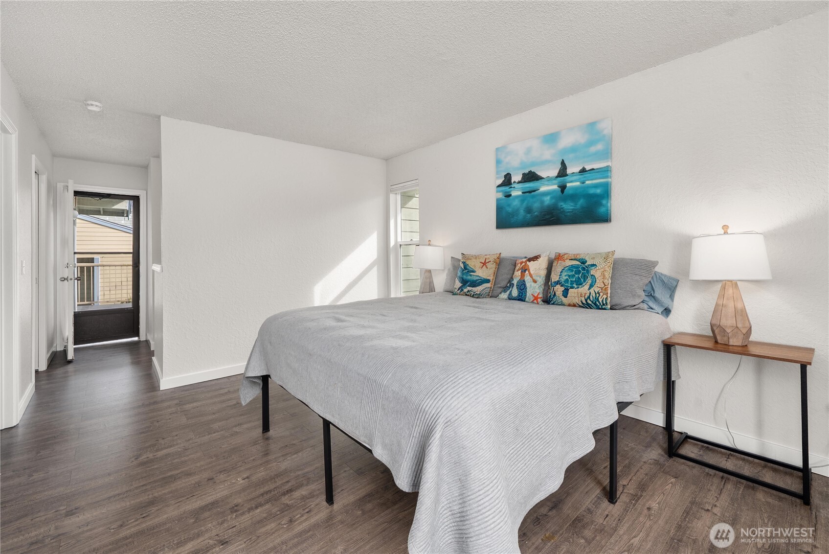 14401 Southeast Petrovitsky Road, Unit G204 Renton, WA 98058 - Photo 14 of 29 a bedroom with a bed and a lamp on table