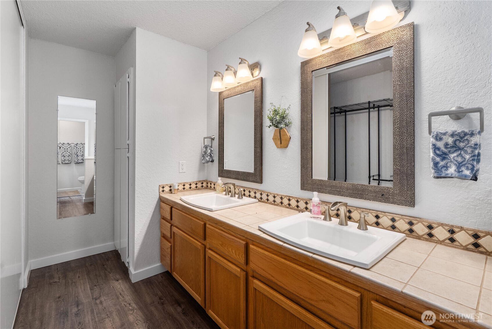 14401 Southeast Petrovitsky Road, Unit G204 Renton, WA 98058 - Photo 15 of 29 a bathroom with a sink and a mirror