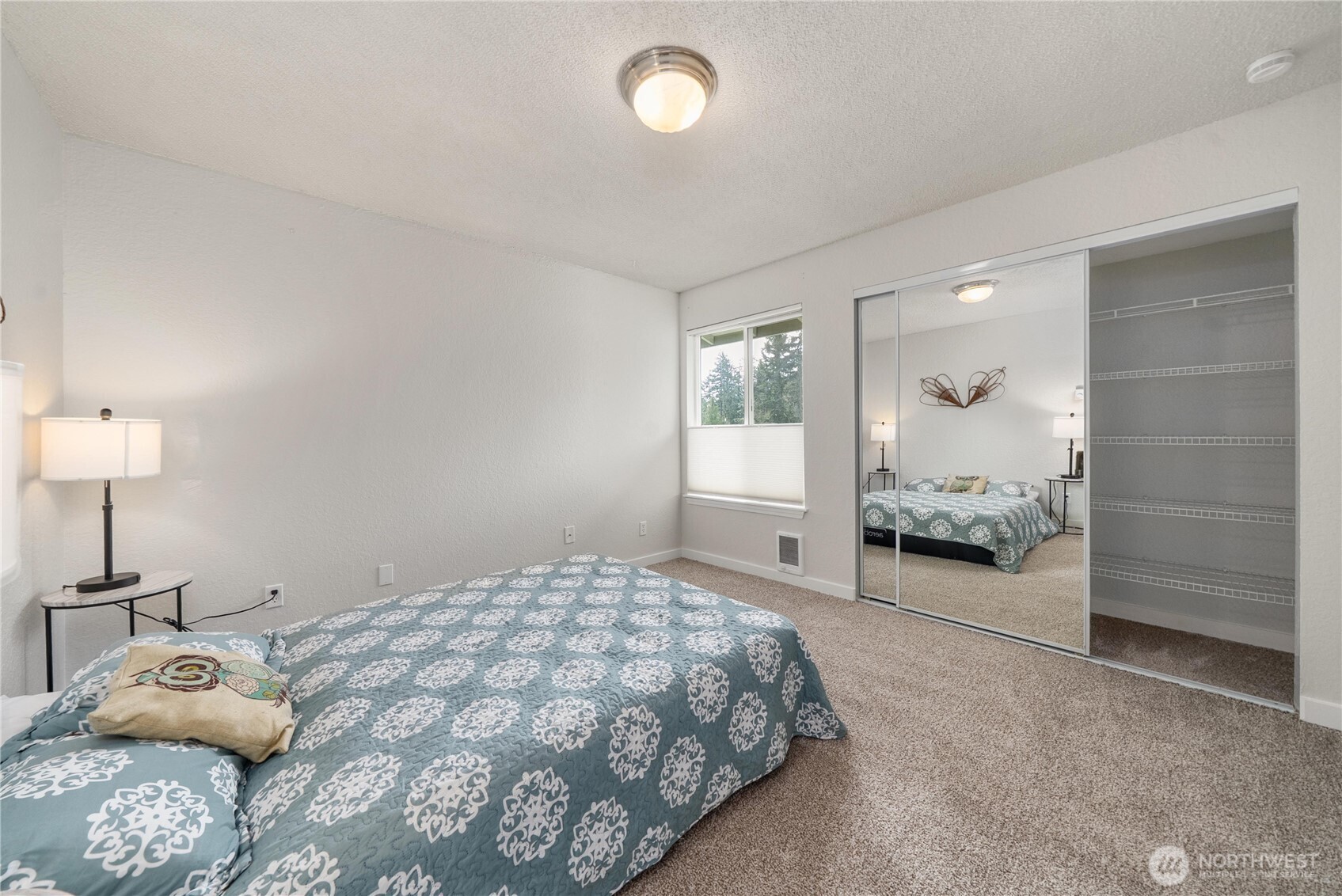 14401 Southeast Petrovitsky Road, Unit G204 Renton, WA 98058 - Photo 19 of 29 a bedroom with a bed and window