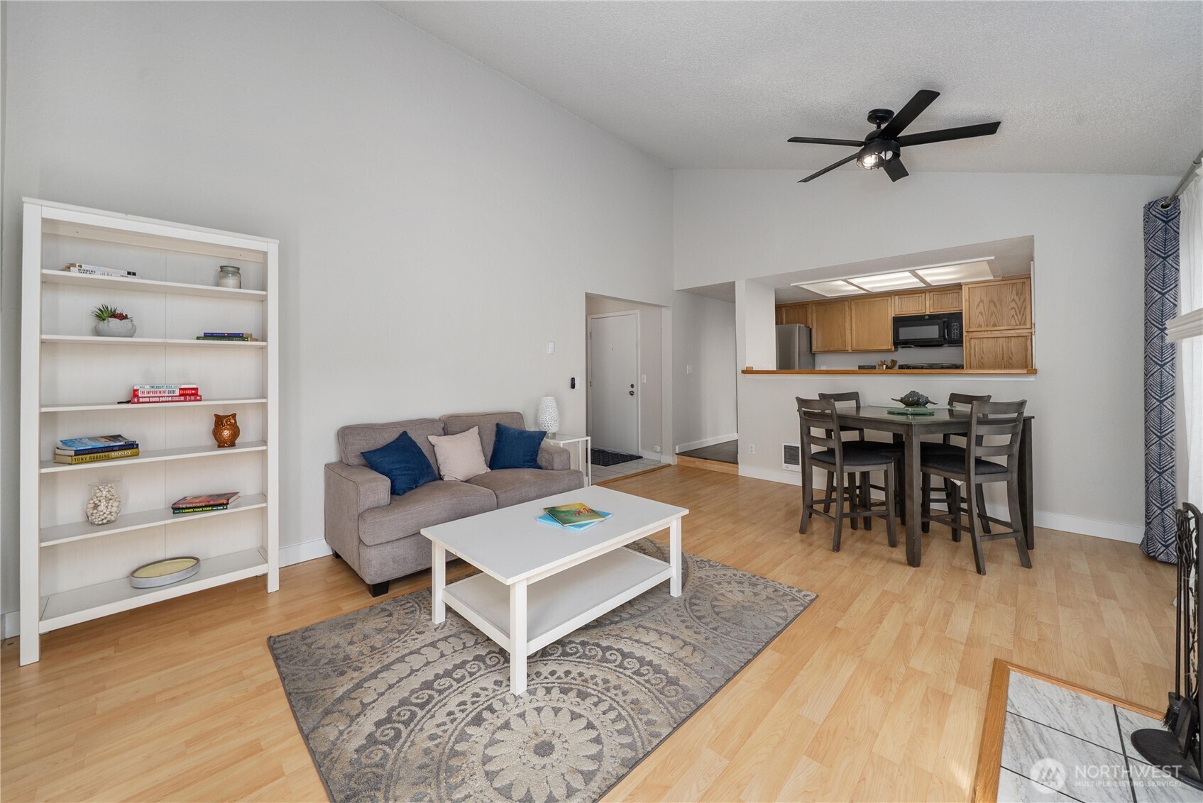 14401 Southeast Petrovitsky Road, Unit G204 Renton, WA 98058 - Photo 5 of 29 a living room with furniture and a flat screen tv