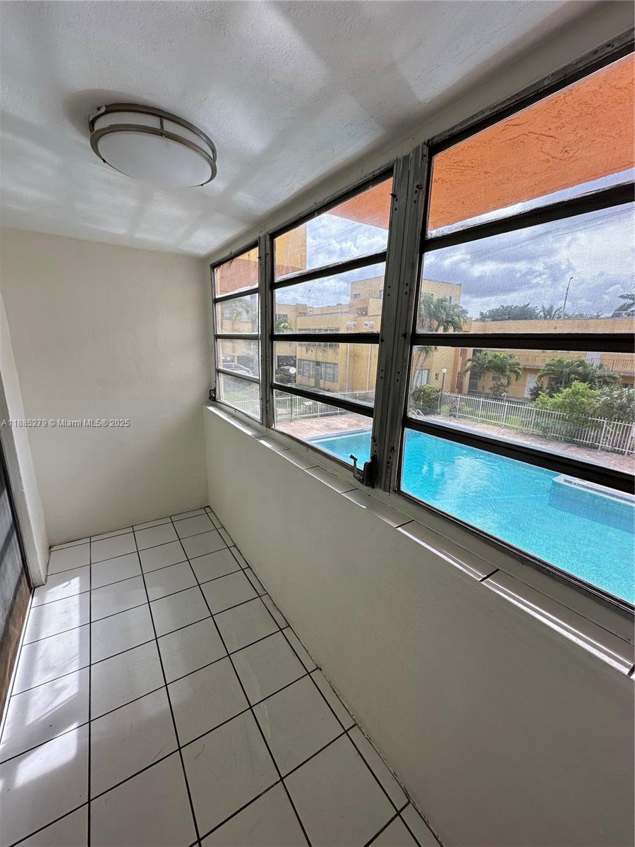 1555 West 44th Place, Unit 234 Hialeah, FL 33012 - Photo 26 of 36 a view of empty room with windows