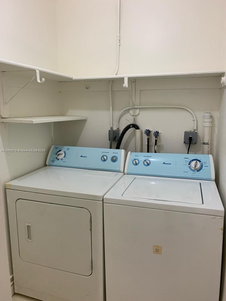 1555 West 44th Place, Unit 234 Hialeah, FL 33012 - Photo 27 of 36 a utility room with dryer and washer