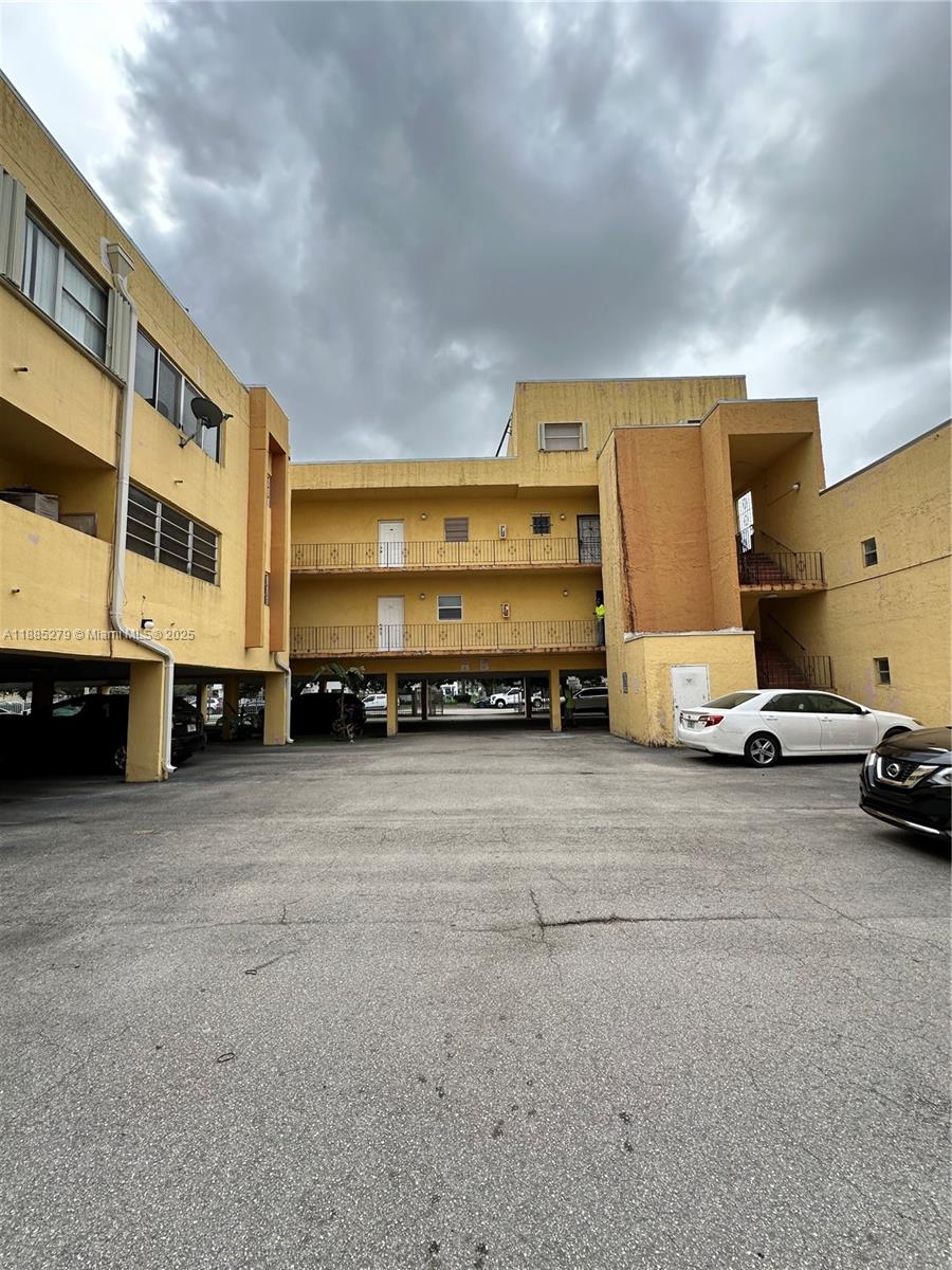 1555 West 44th Place, Unit 234 Hialeah, FL 33012 - Photo 31 of 36 a view of a street with cars