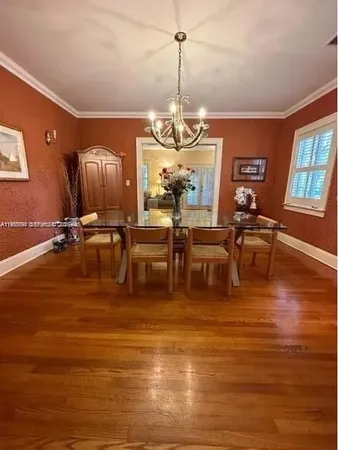 a room with lots of chairs and wooden floor