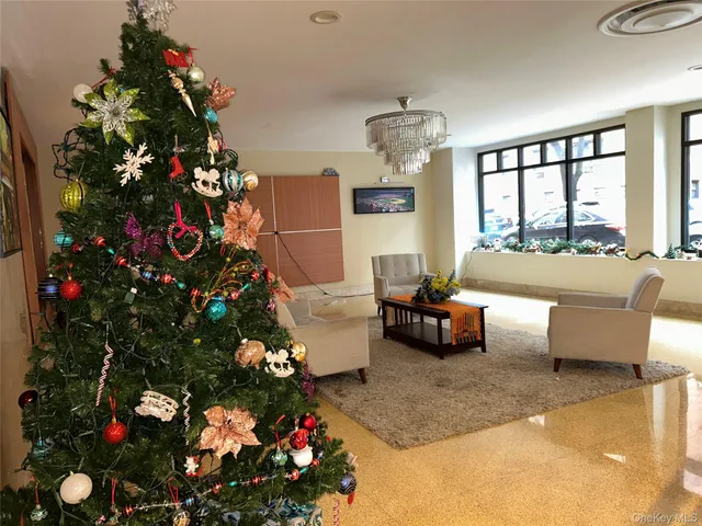 a living room with furniture and flowers