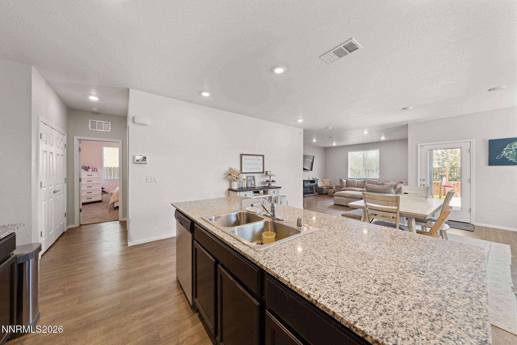 9708 Sea Glass Drive Reno, NV 89506 - Photo 35 of 51 a kitchen with counter top space sink and refrigerator
