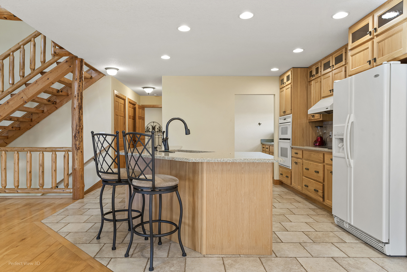 6670 South Old Mazon Road Gardner, IL 60424 - Photo 12 of 36 a kitchen with cabinets and chairs
