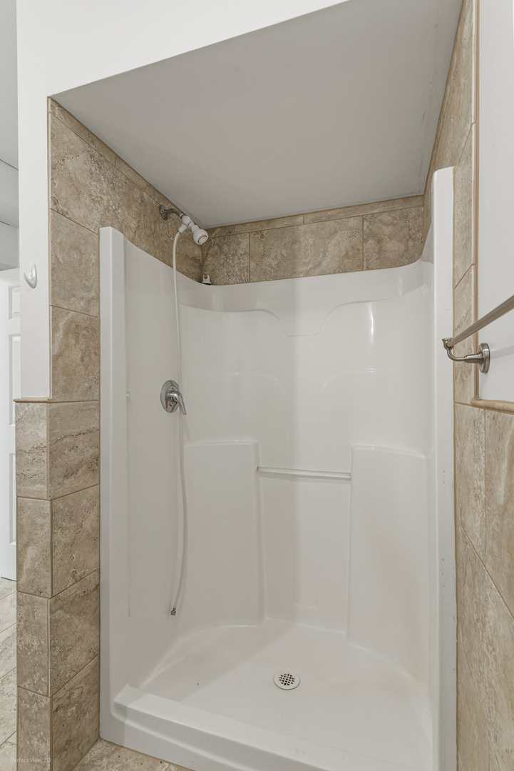 6670 South Old Mazon Road Gardner, IL 60424 - Photo 21 of 36 a bathroom with a shower