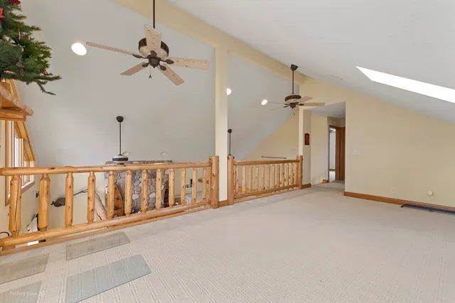 a view of a hallway with a chandelier