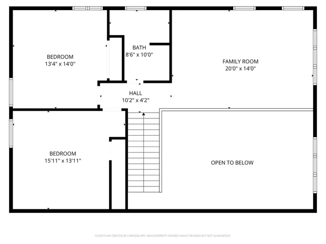 a picture of a room with a white wall and a refrigerator