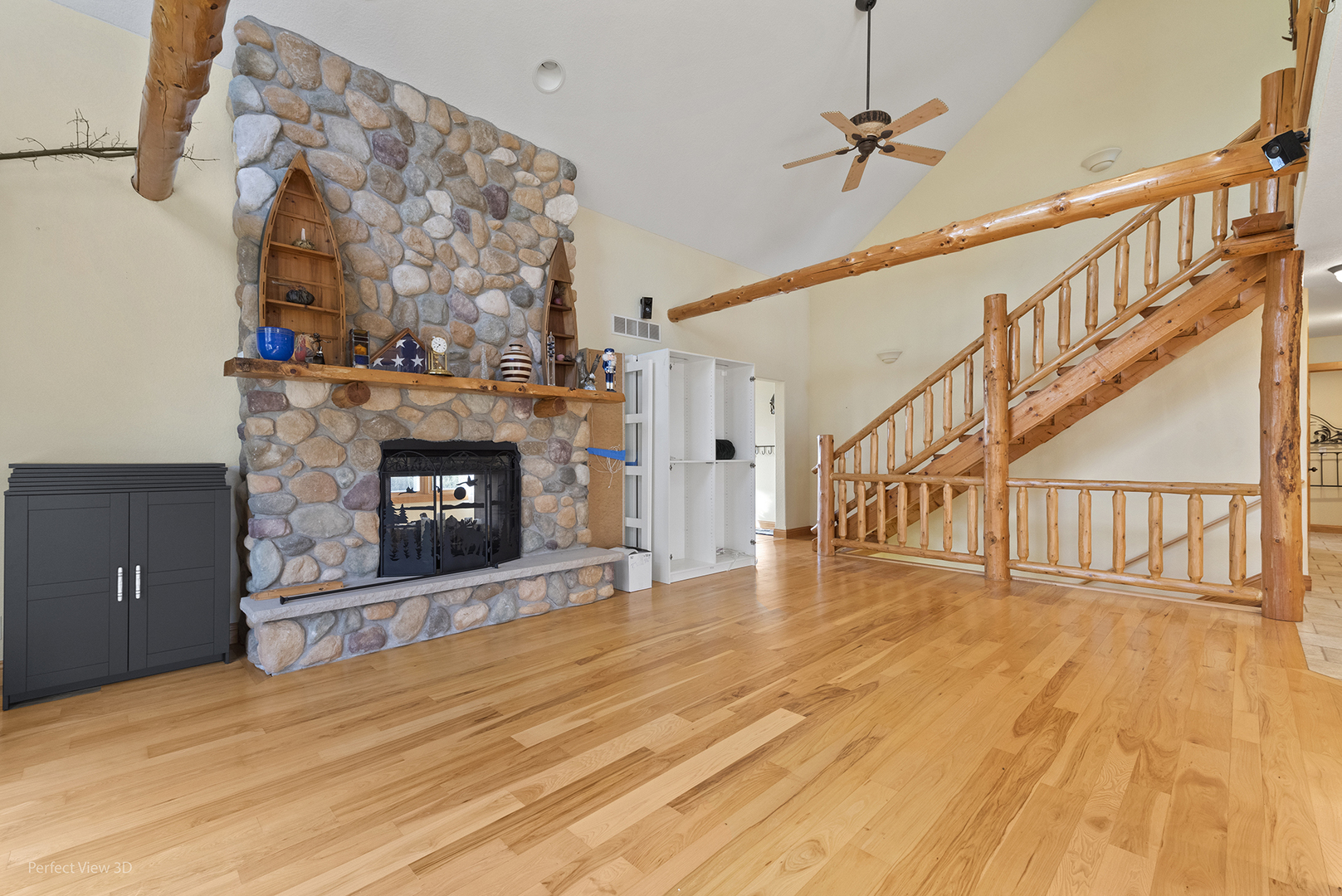 6670 South Old Mazon Road Gardner, IL 60424 - Photo 8 of 36 a view of an empty room with wooden floor and a fireplace
