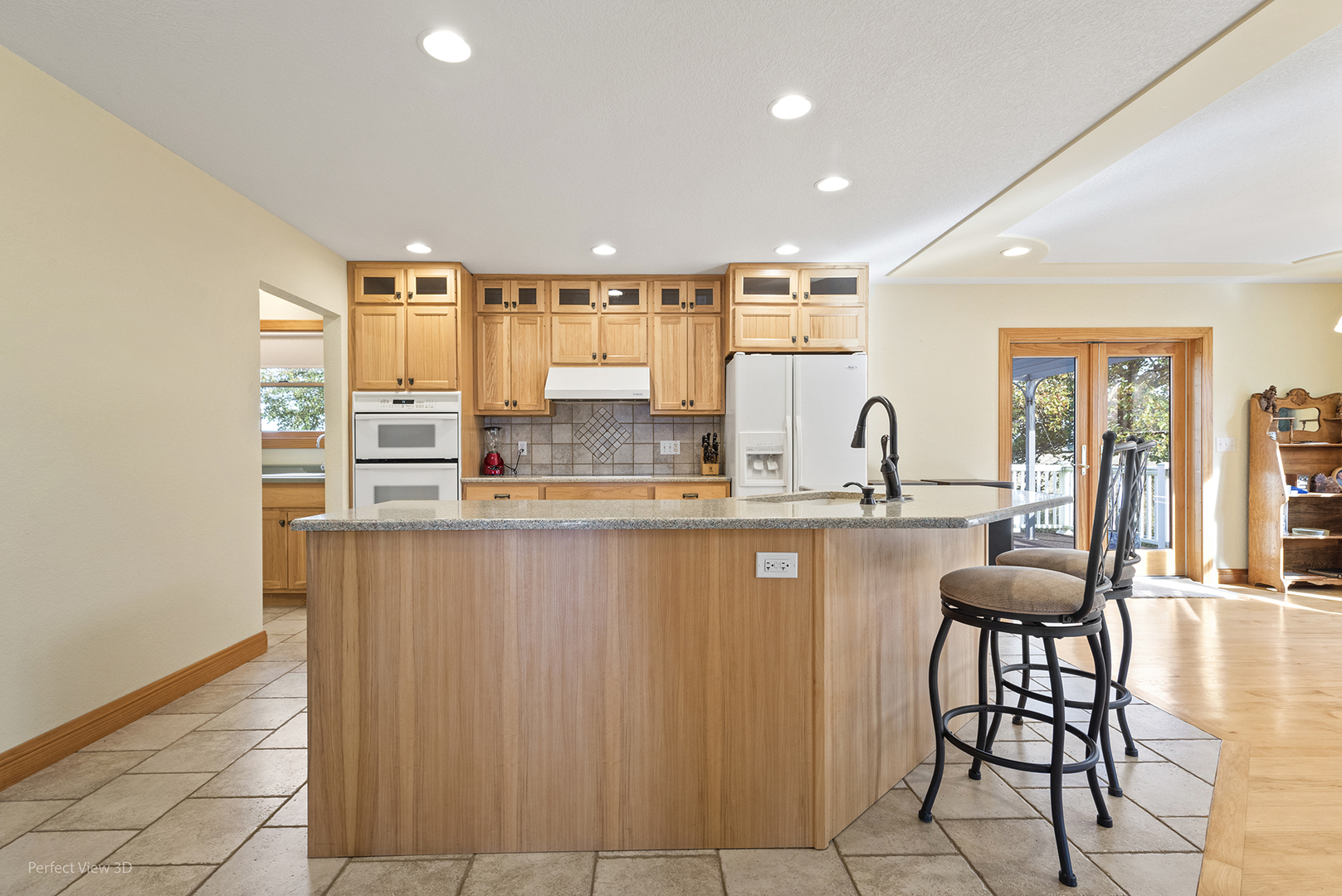 6670 South Old Mazon Road Gardner, IL 60424 - Photo 10 of 36 a kitchen with stainless steel appliances kitchen island granite countertop a table chairs sink and cabinets