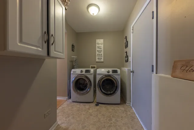 a view of entryway and wooden floor