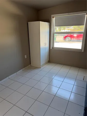 a view of an empty room and window