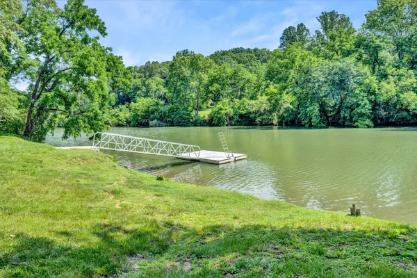 a view of a lake with a building in the background