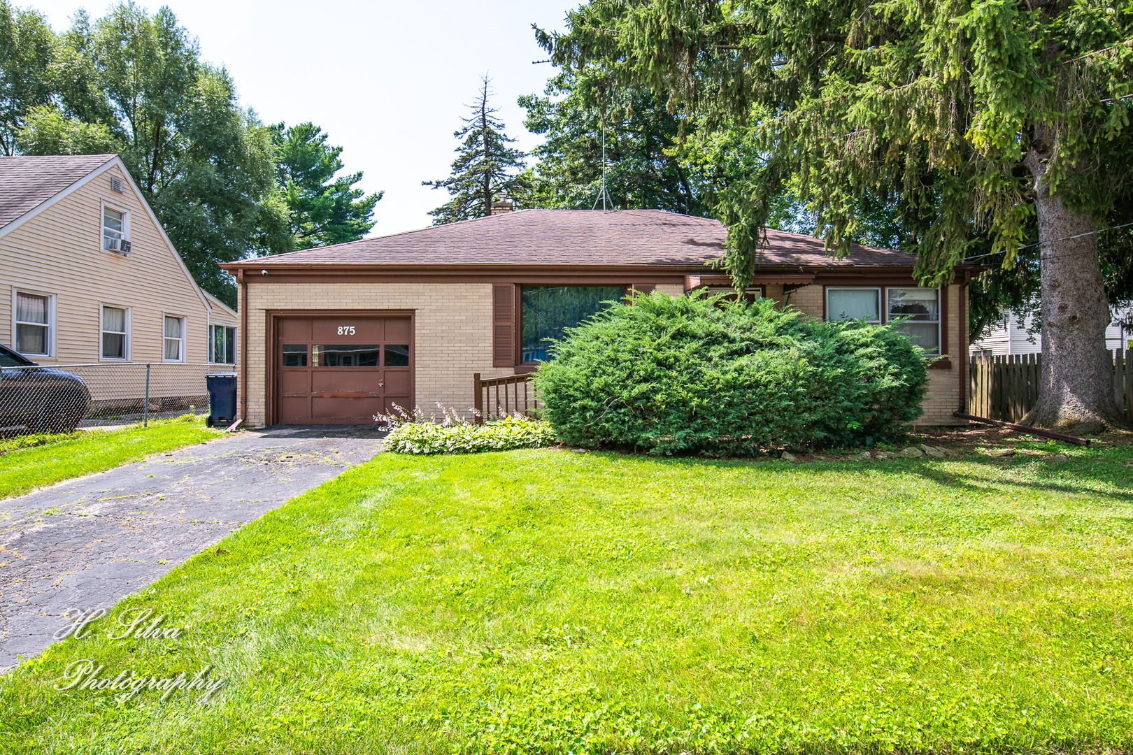 875 Shuler Street Elgin, IL 60123 - Photo 1 of 19 a view of a house with garden and yard
