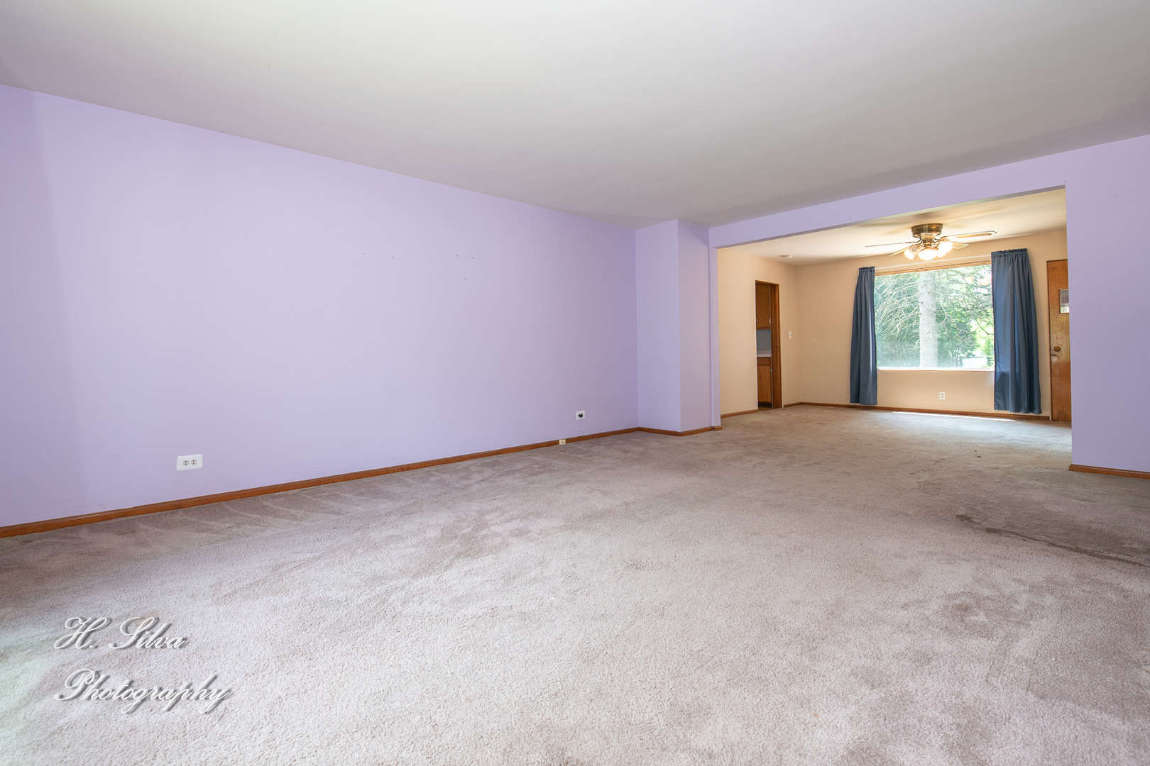 875 Shuler Street Elgin, IL 60123 - Photo 4 of 19 a view of an empty room with large windows