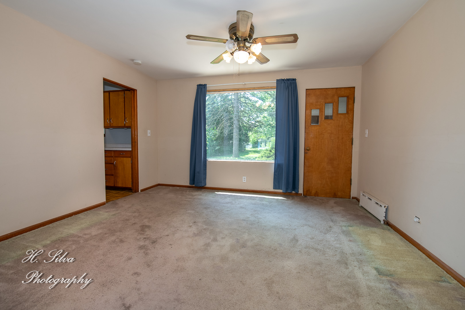 875 Shuler Street Elgin, IL 60123 - Photo 5 of 19 a view of a room with a ceiling fan and a window
