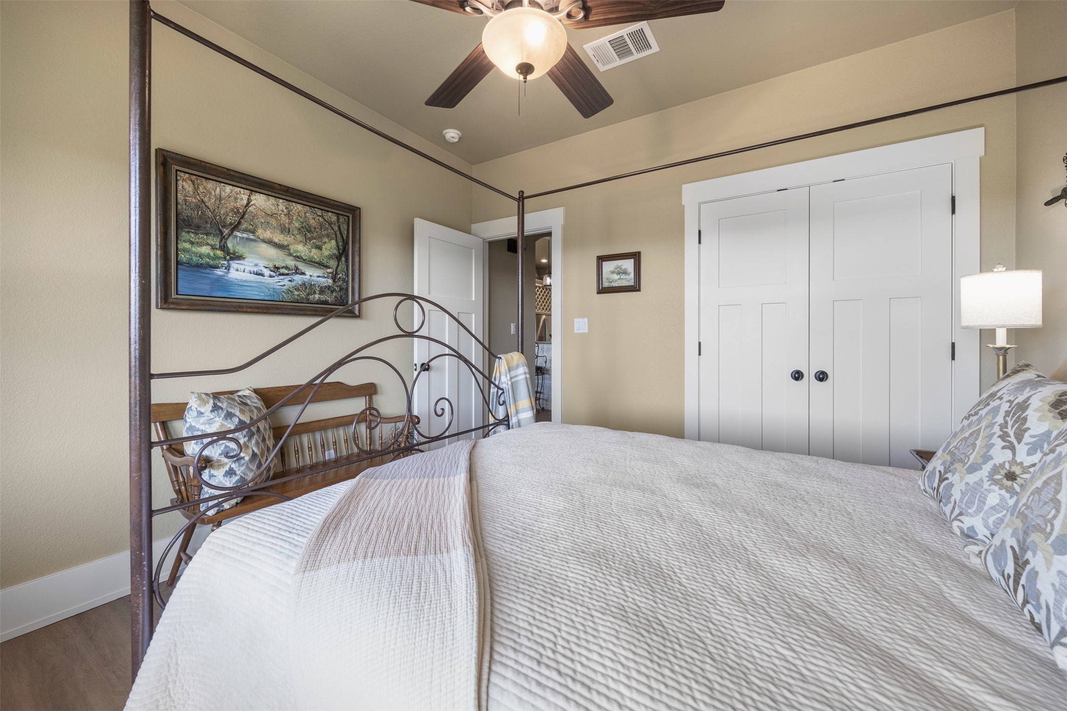 261 Barber Drive Wimberley, TX 78676 - Photo 14 of 37 Bedroom with a closet, a ceiling fan, and wood finished floors