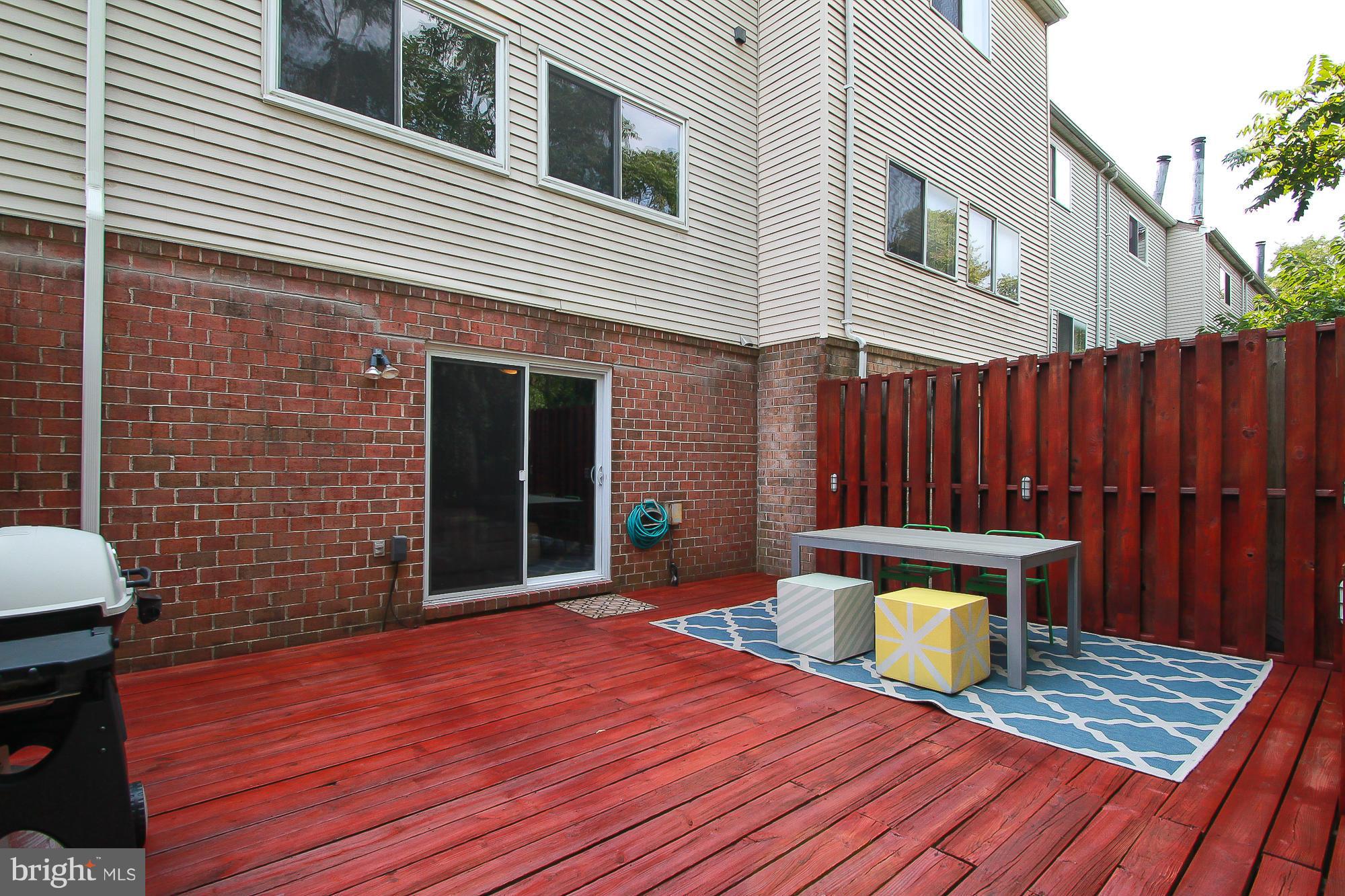 7222 Brookfalls Terrace Baltimore, MD 21209 - Photo 16 of 29 a view of a wooden deck with a patio