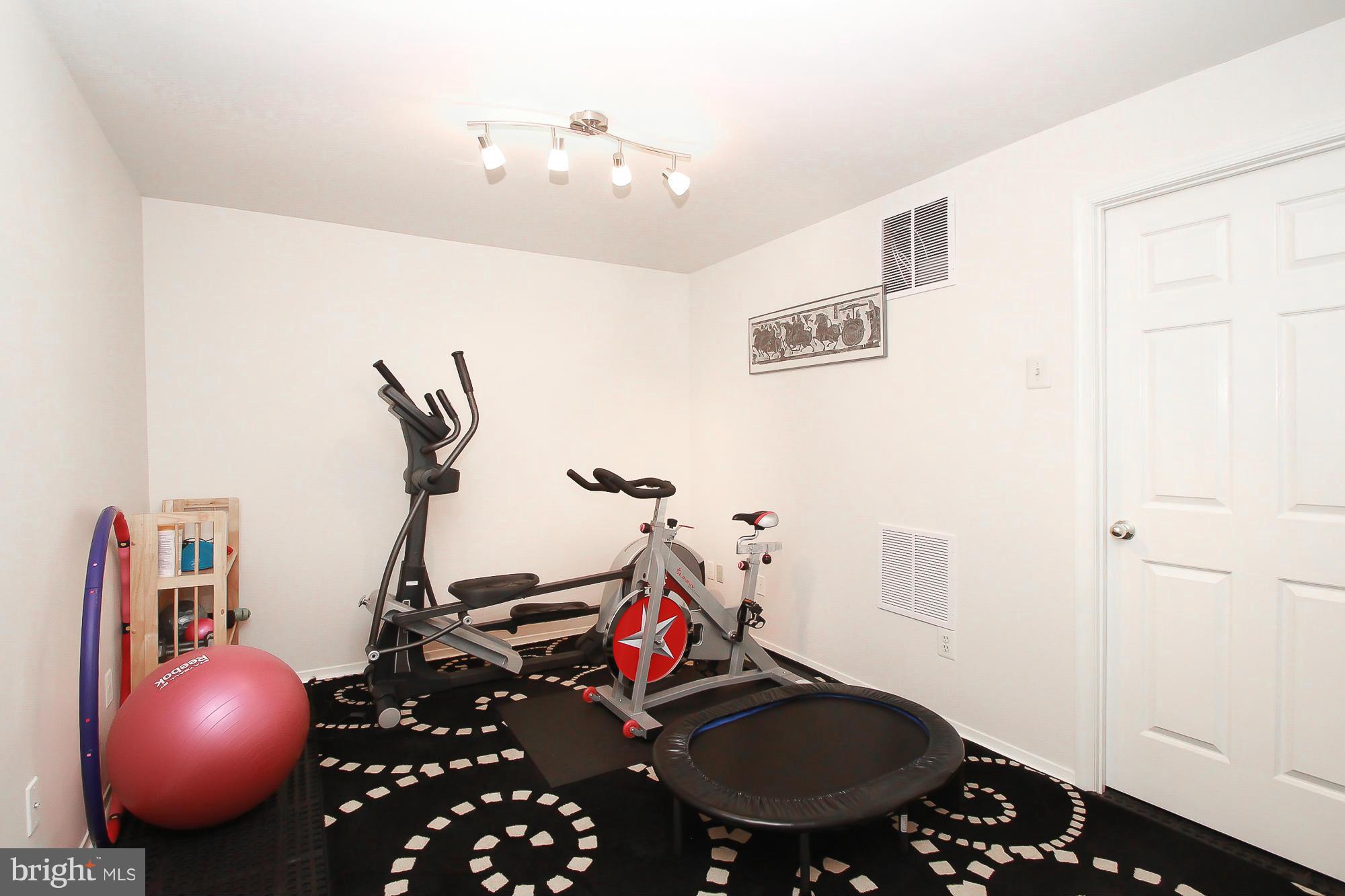 7222 Brookfalls Terrace Baltimore, MD 21209 - Photo 18 of 29 a view of a room with gym equipment