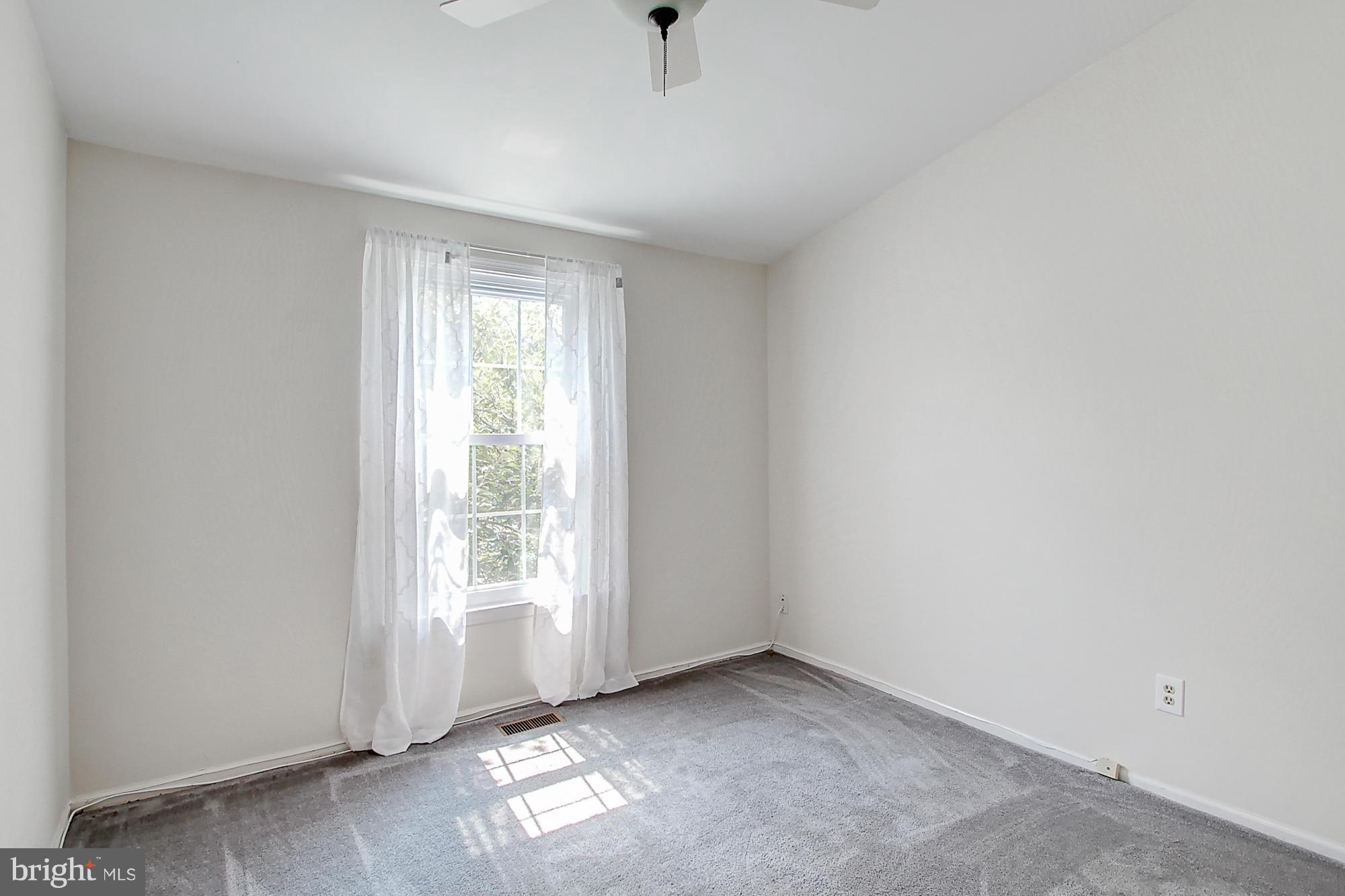7222 Brookfalls Terrace Baltimore, MD 21209 - Photo 19 of 29 a view of an empty room with a window
