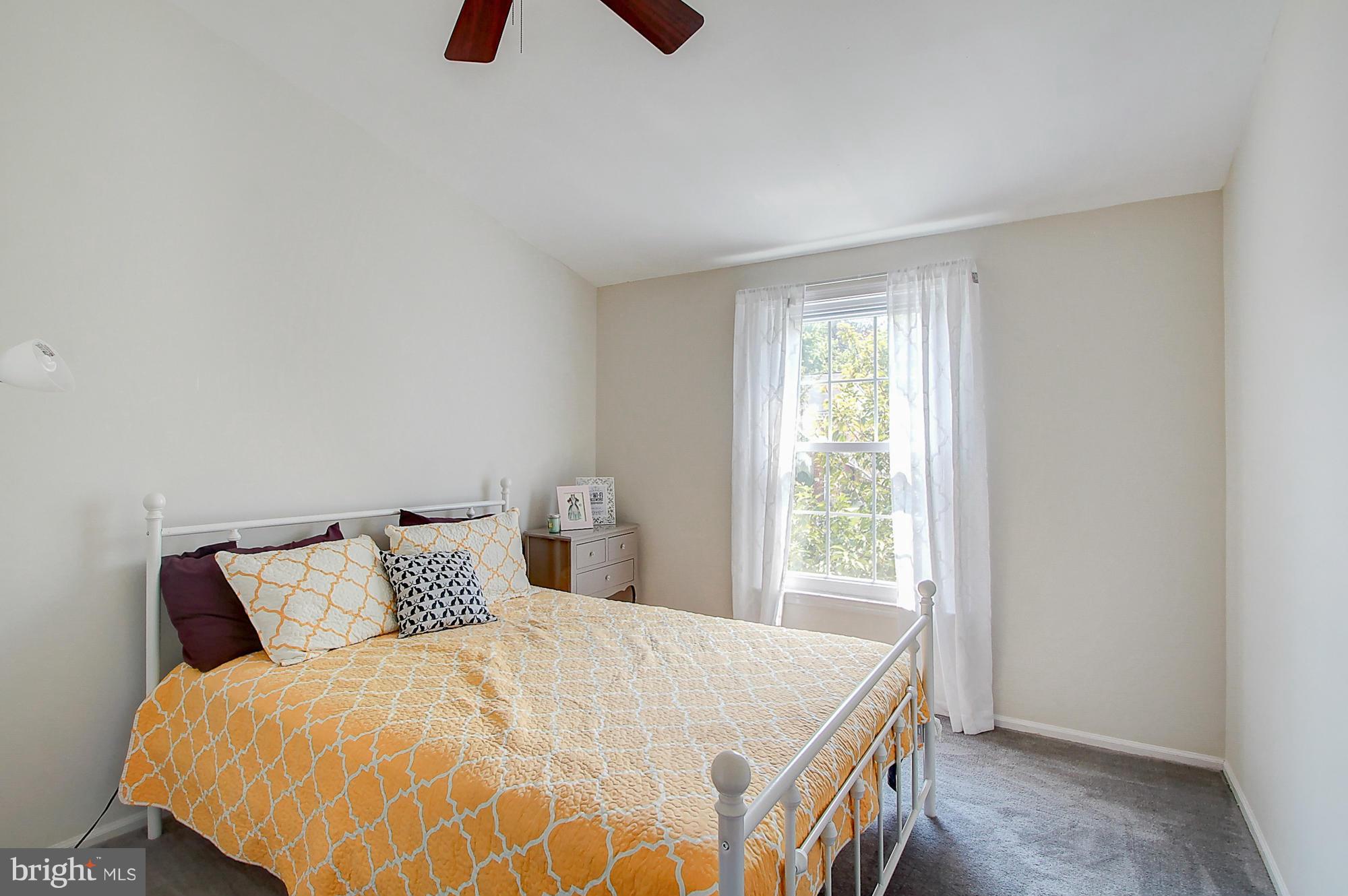7222 Brookfalls Terrace Baltimore, MD 21209 - Photo 21 of 29 a bedroom with a bed and window