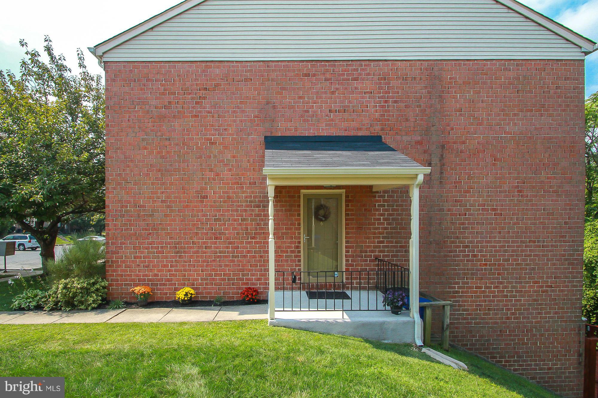 7222 Brookfalls Terrace Baltimore, MD 21209 - Photo 28 of 29 a front view of a house with a garden