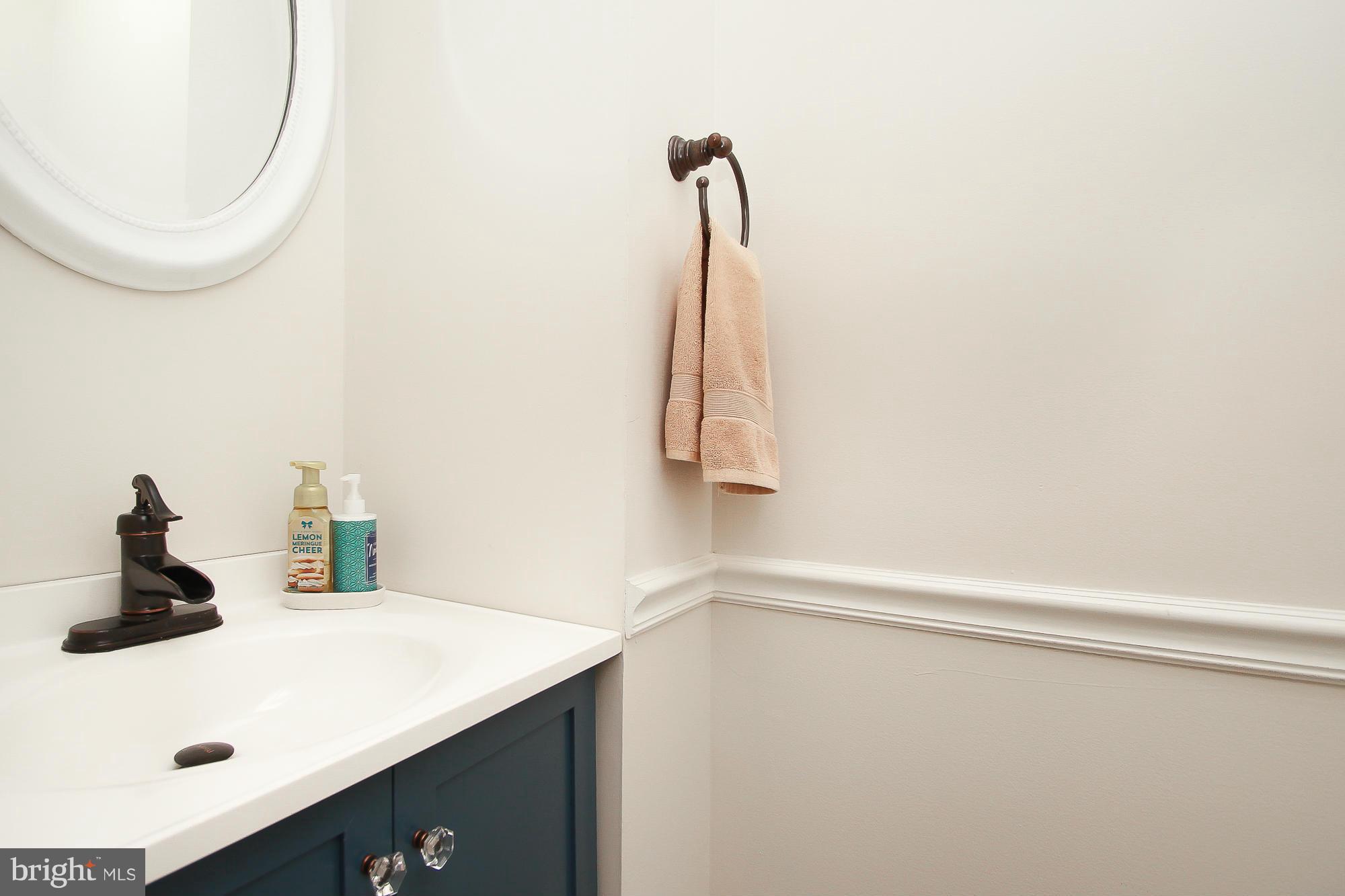 7222 Brookfalls Terrace Baltimore, MD 21209 - Photo 5 of 29 a bathroom with a sink and a mirror