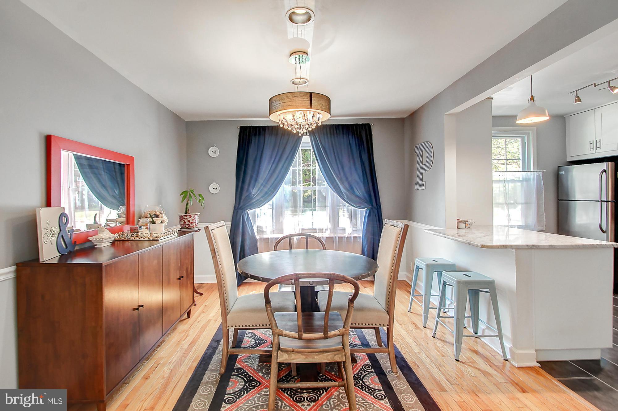 7222 Brookfalls Terrace Baltimore, MD 21209 - Photo 6 of 29 a view of a dining room with furniture window and wooden floor