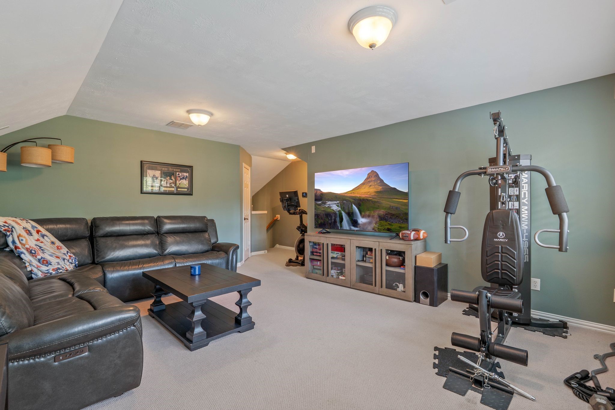 2408 Hollowbrook Lane Conroe, TX 77384 - Photo 32 of 49 Game room is large enough for furniture and exercise equipment. Located upstairs and can be used for media and gaming.
