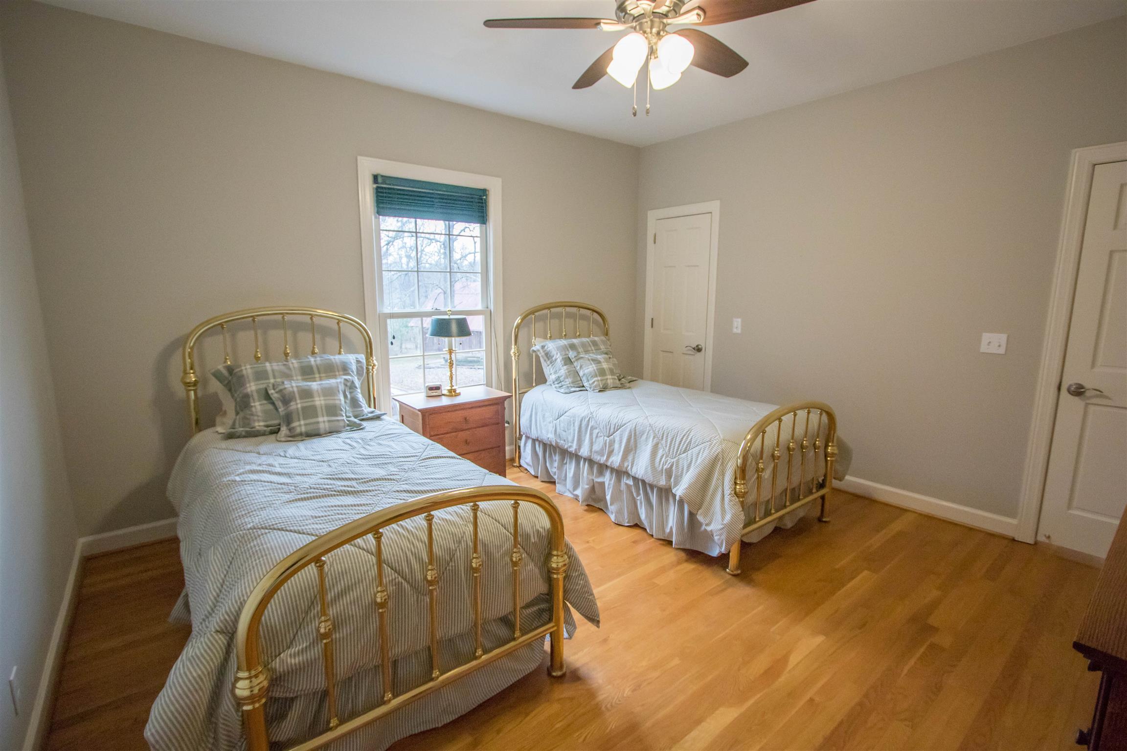 4304 Warren Road Franklin, TN 37067 - Photo 14 of 30 a bedroom with two beds and a chandelier