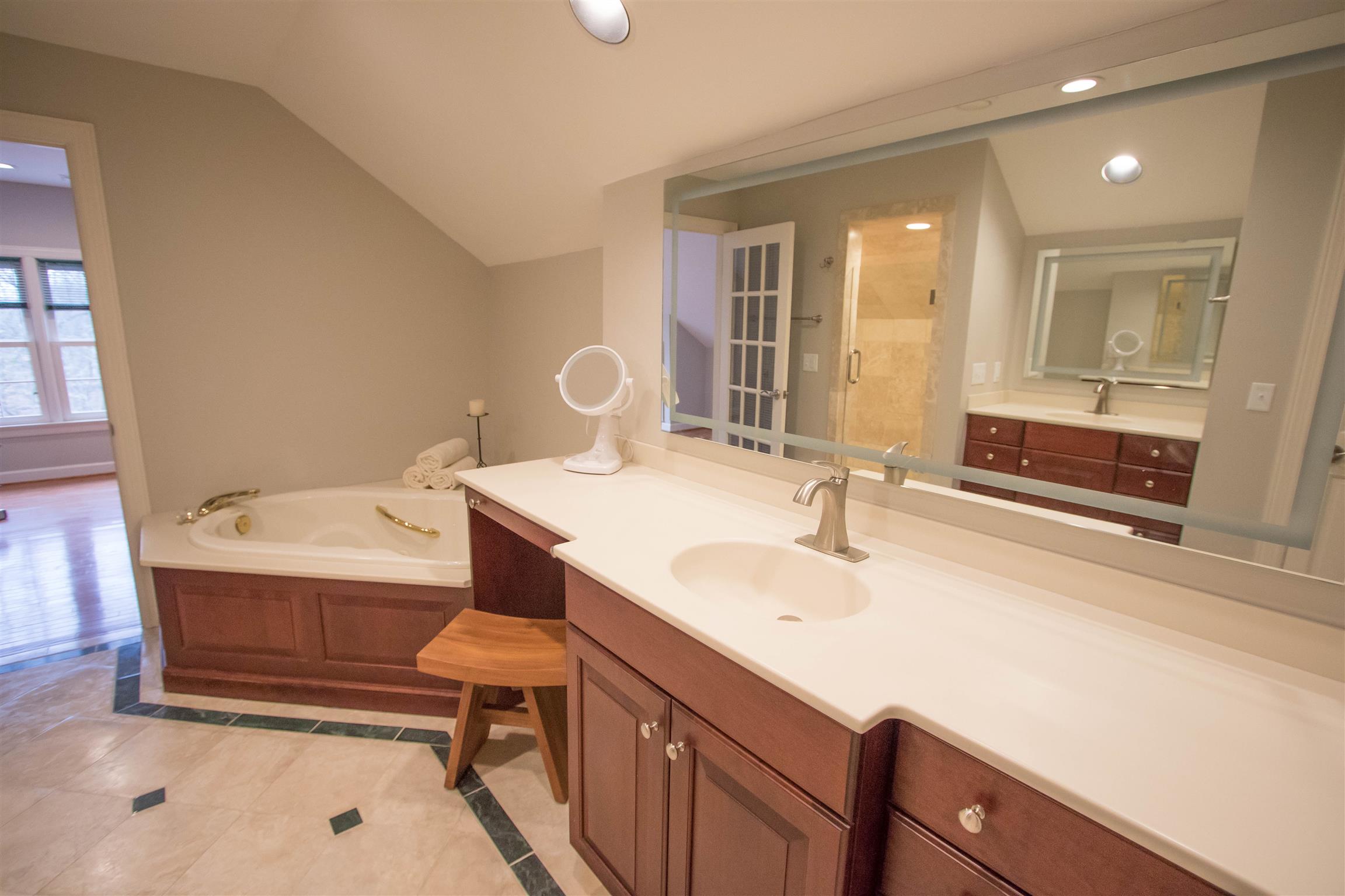 4304 Warren Road Franklin, TN 37067 - Photo 21 of 30 a bathroom with a sink and a mirror