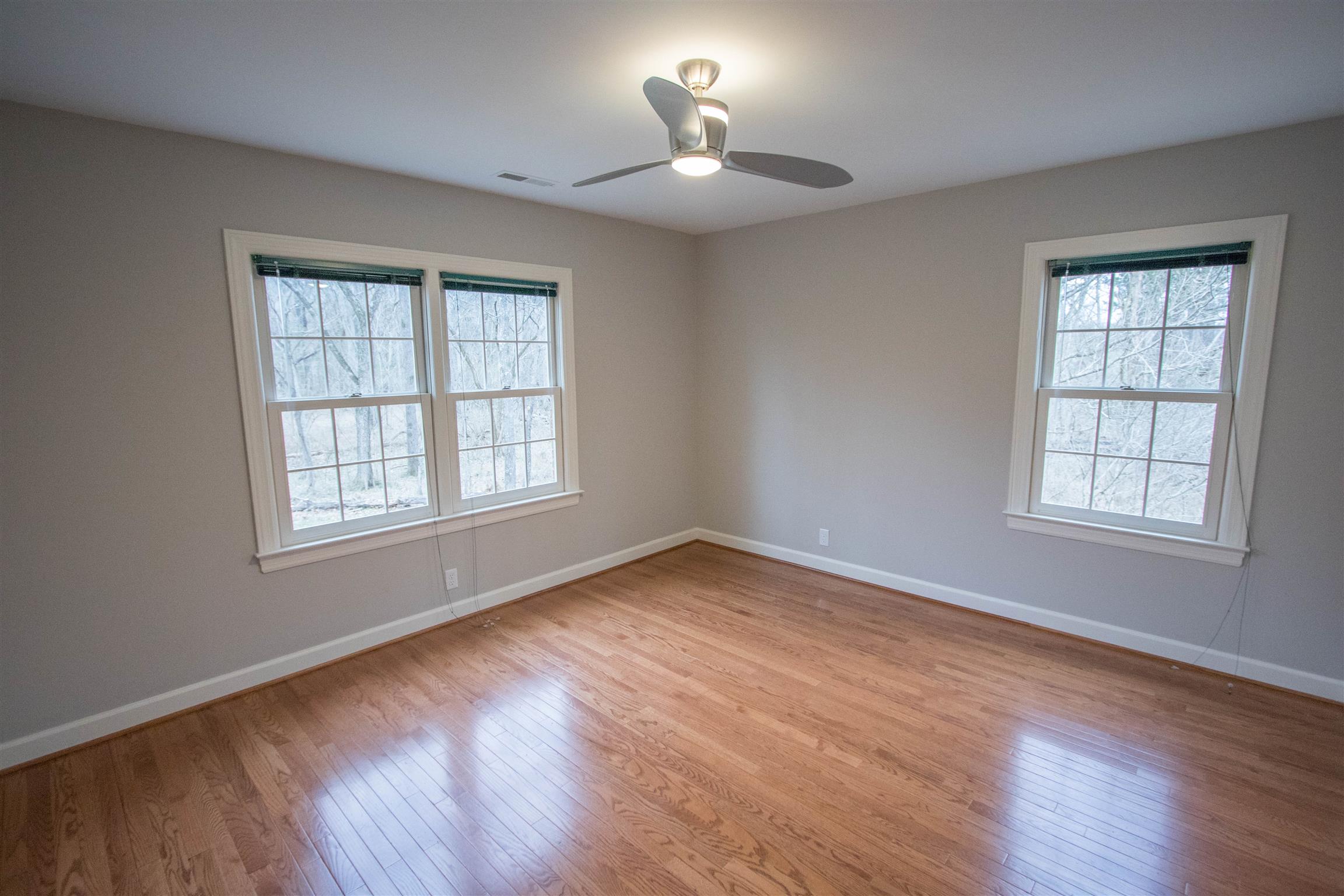 4304 Warren Road Franklin, TN 37067 - Photo 23 of 30 a view of an empty room with wooden floor and a window